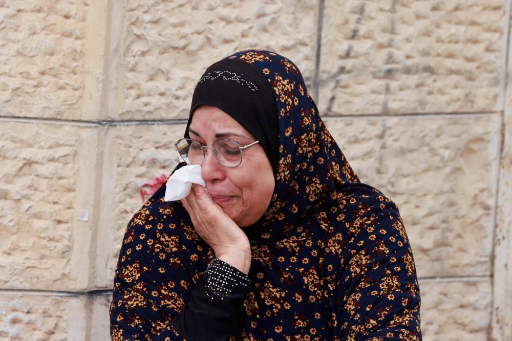 A Palestinian woman reacts during a large-scale Israeli army raid in Jenin, in the occupied West Bank, on Friday. AFP