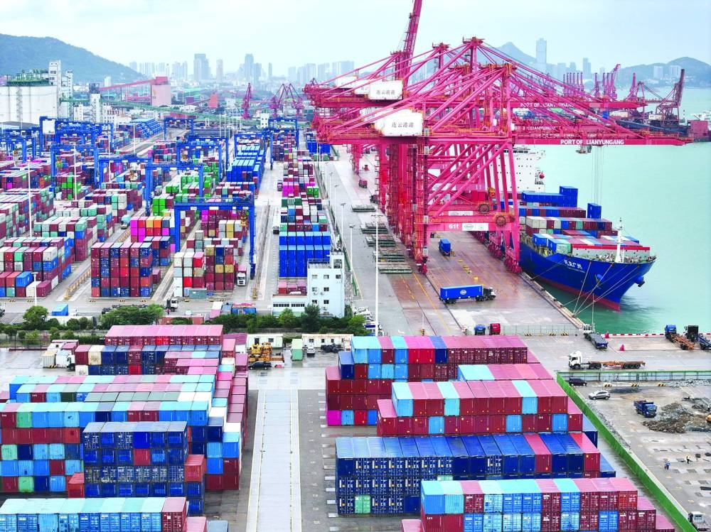 
FILE PHOTO: A drone view shows a cargo ship and shipping containers at the port of Lianyungang in Jiangsu province, China, on October 17, 2024. (Reuters) 