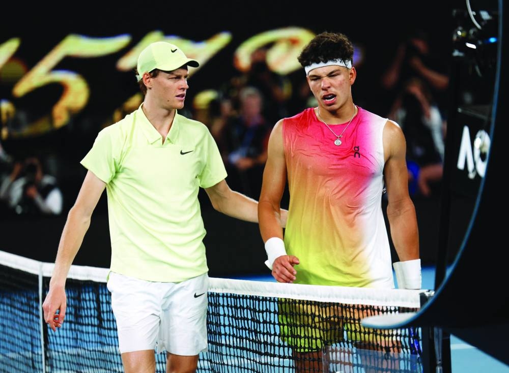 Italy's Jannik Sinner (left) with Ben Shelton of the US after winning his semi-final at the Australian Open in Melbourne on Friday. (Reuters)