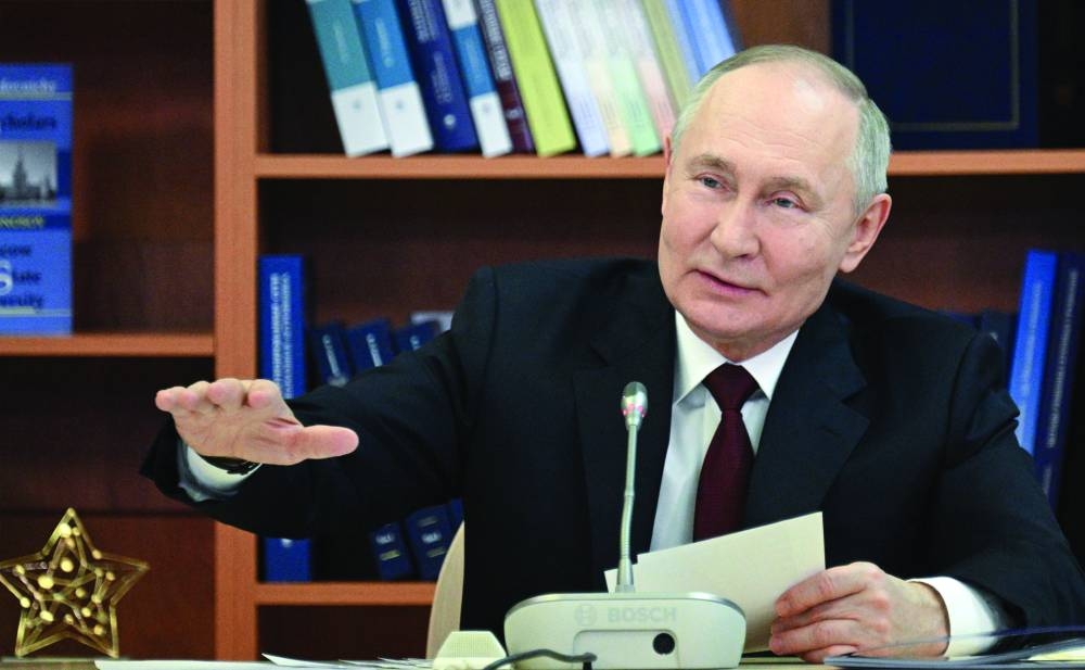 Putin is seen speaking to reporters during his visit to the Lomonosov Moscow State University. – Reuters