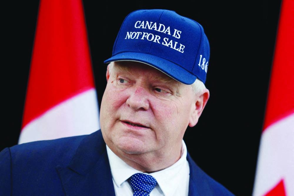 Ontario Premier Doug Ford is seen wearing a ‘Canada is not for sale’ cap. – Reuters