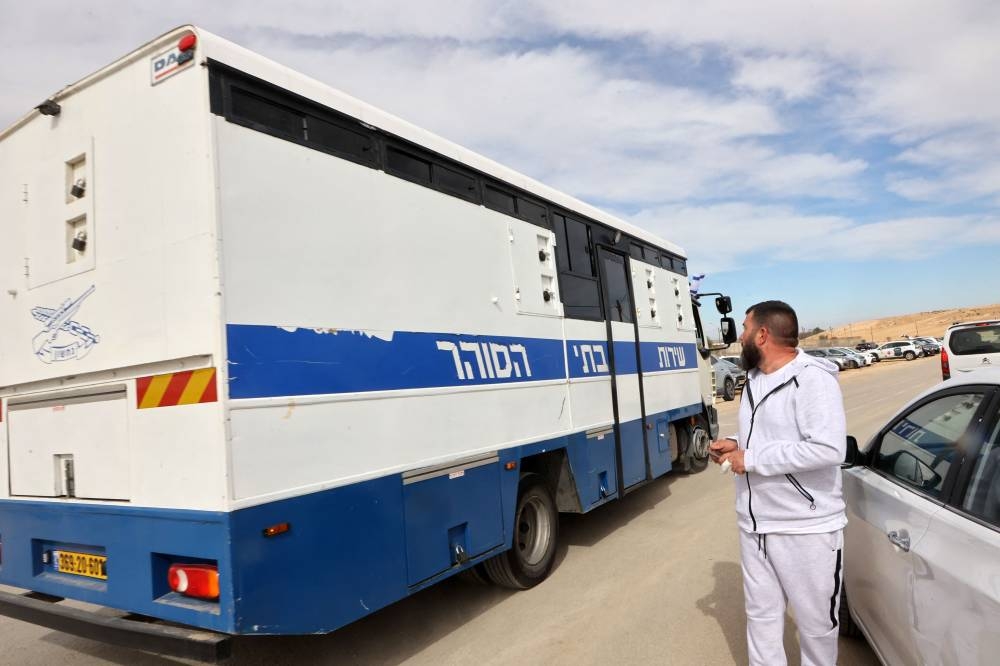 A bus transporting Palestinian prisoners leaves the Kziot prison in the Negev desert on Saturday. AFP