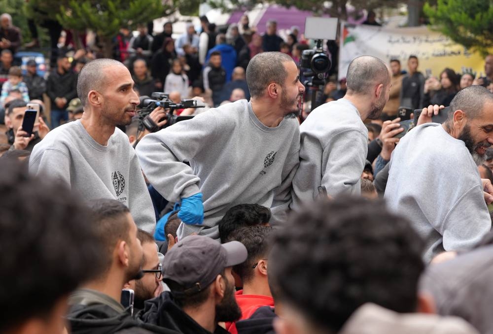 Freed Palestinian prisoners are greeted by people after they were released from an Israeli jail, in Ramallah, in the Israeli-occupied West Bank, on Saturday. REUTERS