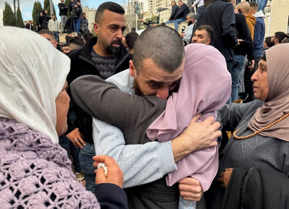 A freed Palestinian prisoner is greeted after being released from an Israeli ja, in Ramallah, in the Israeli-occupied West Bank, on Saturday. REUTERS
