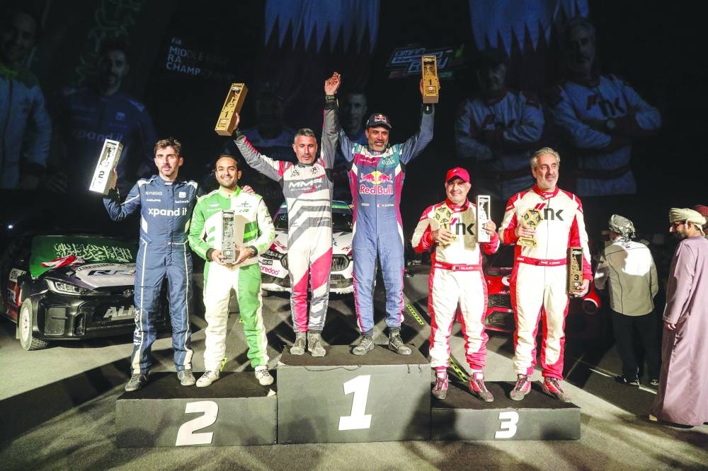 Qatar’s Nasser Saleh al-Attiyah and co-driver Candido Carrera of Spain celebrate after winning the Oman International Rally on Saturday. Saudi’s Rakan al-Rashed and Portugal’s Hugo Magalhaes finished second, while Qatar’s Nasser Khalifa al-Attiyah and Lebanese co-driver Ziad finished third.