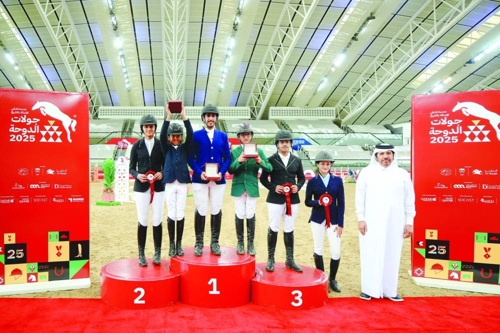 
Top six finishers of the National Competition Optimum Time pose with Ahmed Khalid al-Humaidi, Heritage Specialist at Al Shaqab. 