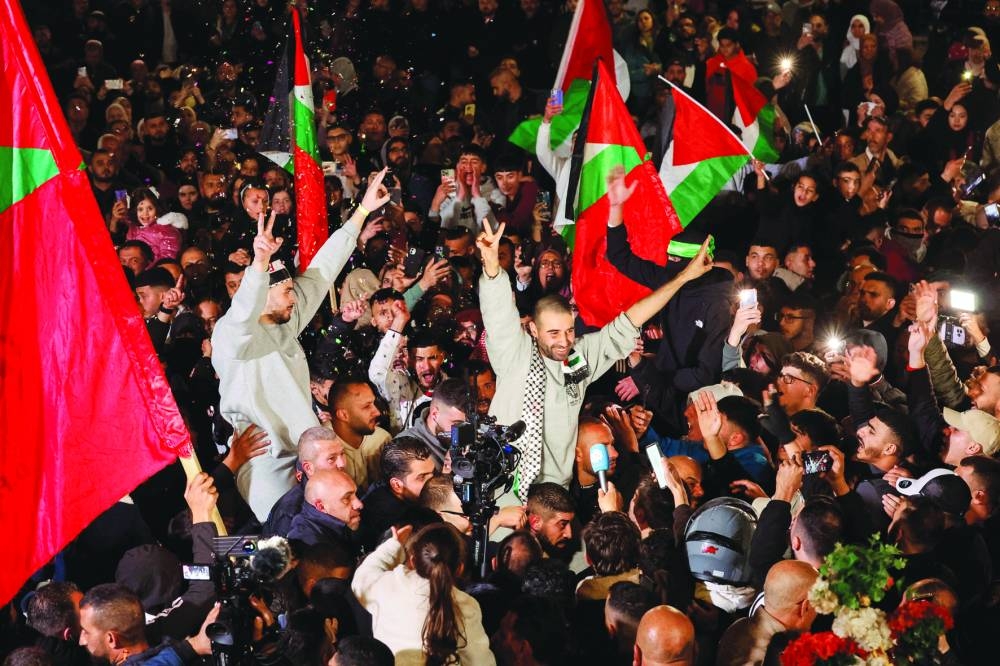 
Freed Palestinian prisoners react in Ramallah, yesterday. 