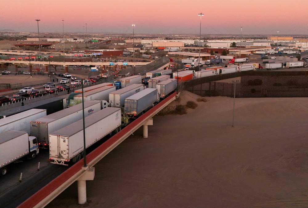 A drone view shows trucks waiting in line at the Zaragoza-Ysleta border crossing bridge to cross into the US, as new tariffs are expected soon from US President Donald Trump, in Ciudad Juarez, Mexico, on Friday. REUTERS