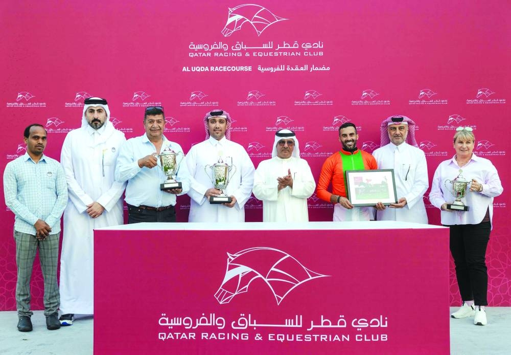 Connections of Al Shomos celebrate after the mare won the Marmi Cup at Al Uqda Racecourse on Saturday.