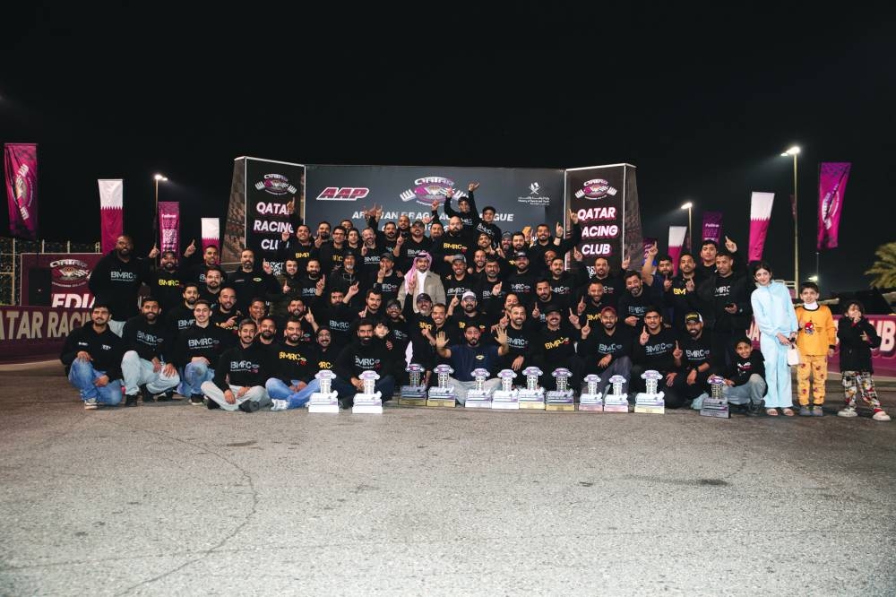 
QRC Director General Sheikh Jabor bin Khalid al-Thani poses with the winners of the fourth round of the Arabian Drag Racing League. 