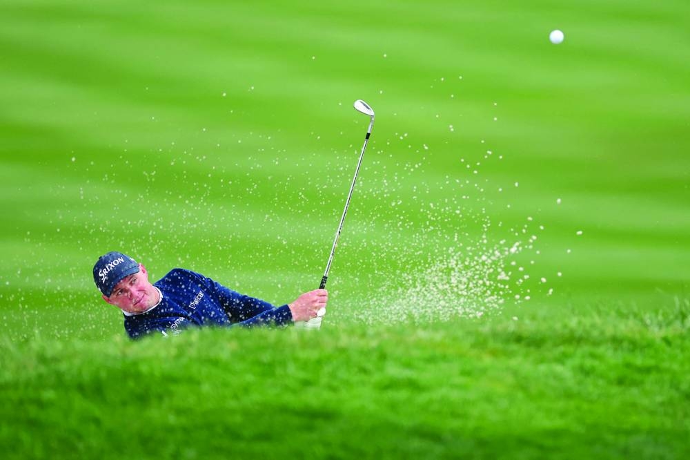
Sepp Straka of Austria plays a shot from a bunker on the 18th hole during the third round of the AT&T Pebble Beach Pro-Am 2025 at Pebble Beach Golf Links in Pebble Beach, California. (AFP) 