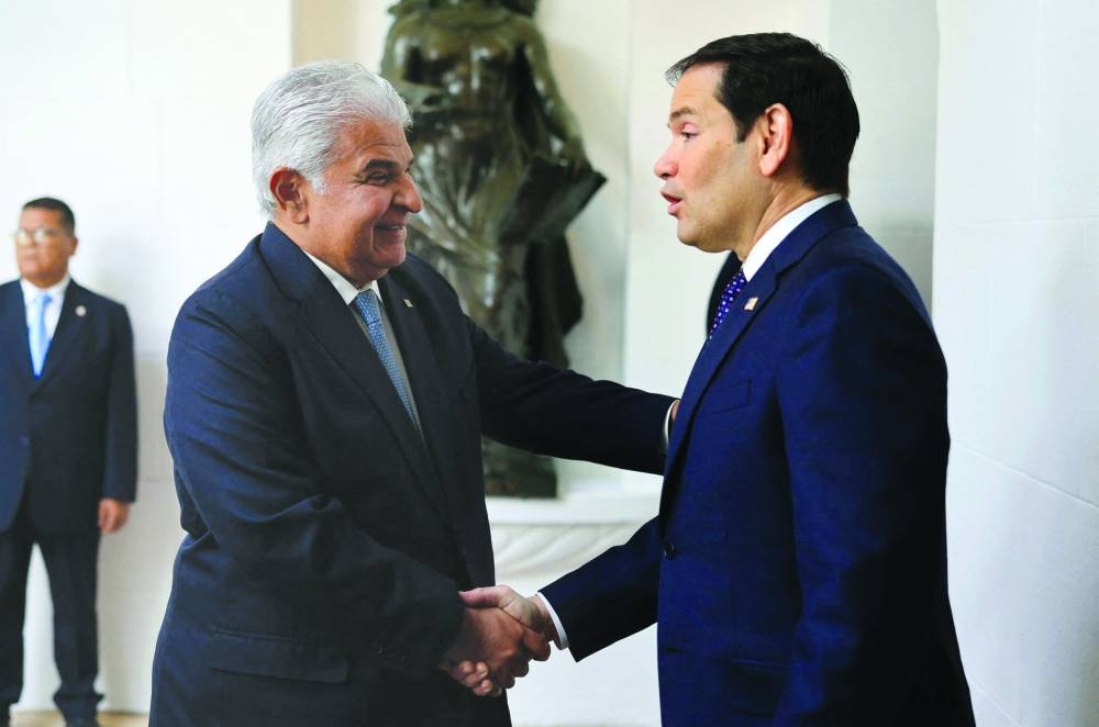 
Panama’s President Jose Raul Mulino (left) greeting US Secretary of State Marco Rubio on arrival at the presidential palace in Panama City yesterday. (AFP) 