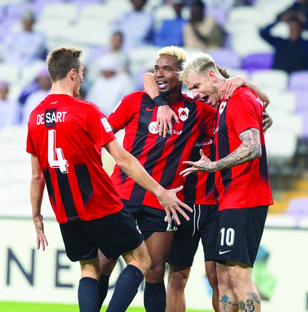 Al Rayyan forward Roger Guedes (right) celebrates with teammates after scoring a goal against UAE’s Al Ain during their AFC Champions League Elite match in Al Ain on Monday.
