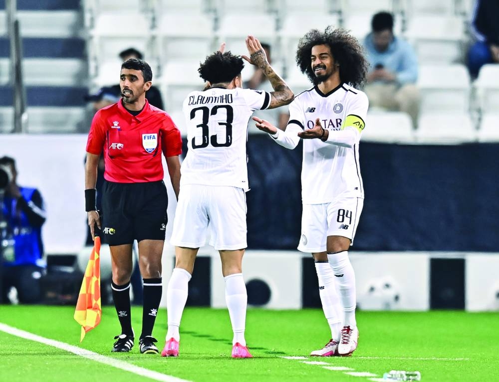 Al Sadd captain Akram Afif celebrates with teammate after scoring against Saudi Arabia’s Al Ahli at the Jassim Bin Hamad Stadium in Doha on Monday. PICTURE: Noushad Thekkayil