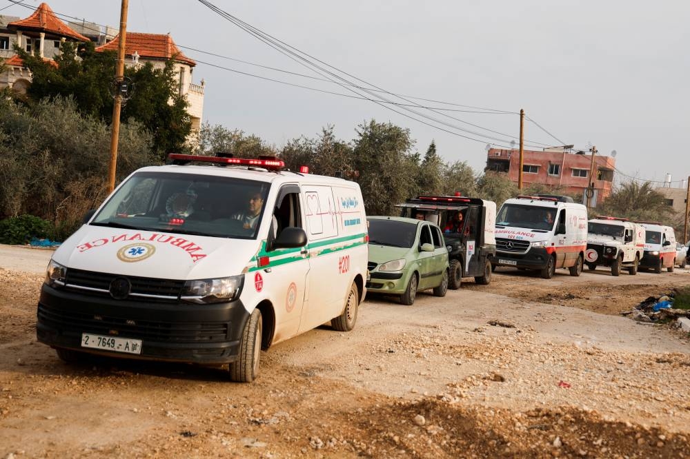 Ambulances carrying the bodies of Palestinians killed during an Israeli raid, arrive for the funeral, in Jenin, in the Israeli-occupied West Bank, on Monday. REUTERS