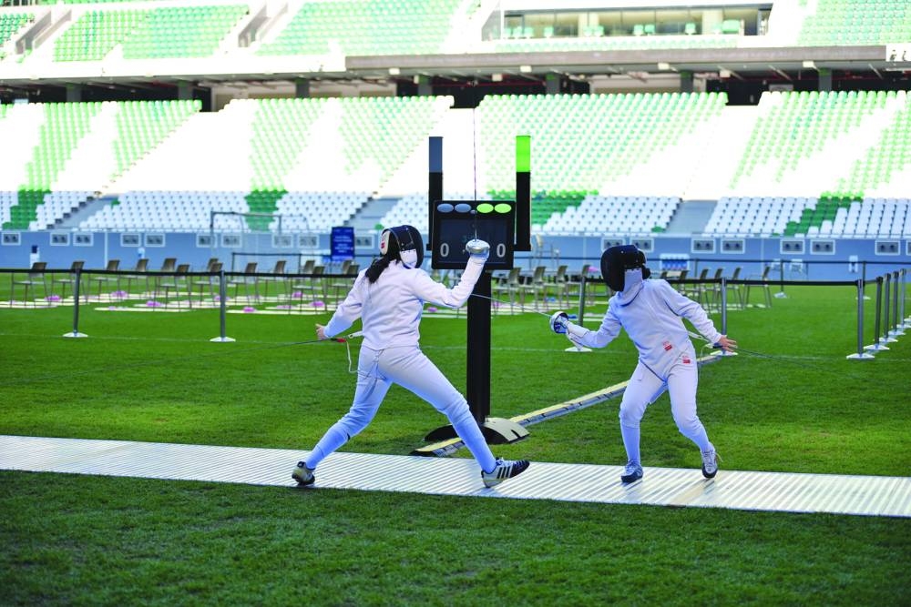 Aspiring Qatari girl fencers in action at the event Tuesday.