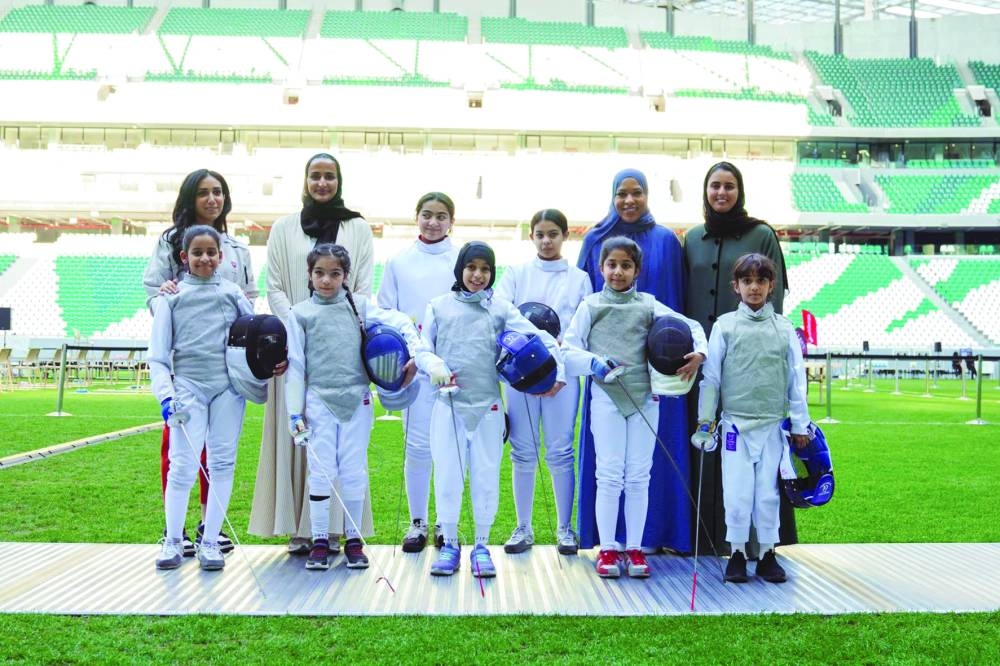 QF Vice Chairperson and CEO HE Sheikha Hind bint Hamad al-Thani, Creating Pathways Programme ambassador and US Olympic medallist Ibtihaj Muhammad, and Tunisian Olympic medallist Inès Boubakri are seen with a group of aspiring Qatari girl fencers at the event Tuesday.