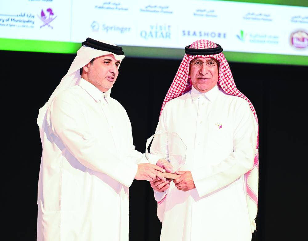 Dr Salem al-Naemi honouring HE Dr Abdullah bin Abdulaziz bin Turki al-Subaie. ( Supplied picture.)