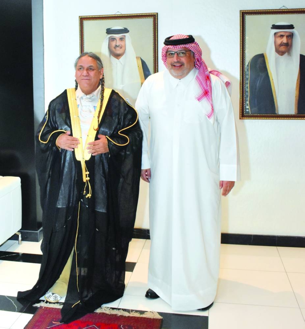 Gulf Times Editor-in-Chief, Faisal Abdulhameed al-Mudahka with Albert 'Nino' Reyos wearing a Qatari Bisht. PICTURES: Thajudheen