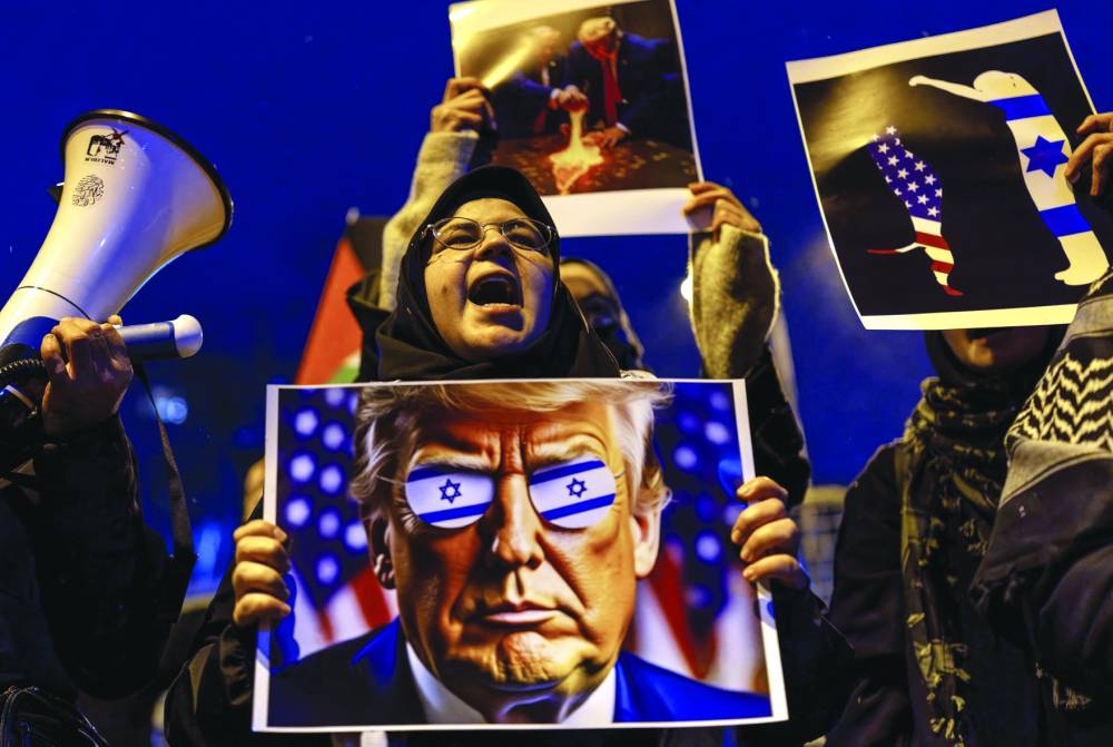 Demonstrators attend a protest against U.S. President Donald Trump's plan to resettle Palestinians from Gaza, in front of the U.S. consulate in Istanbul,on Thursday 