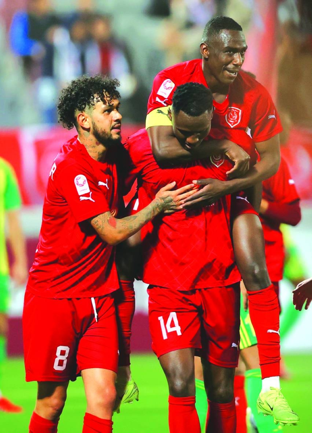 Al Duhail’s Michael Olunga (centre) celebrates with teammates after scoring against Al Wakrah.