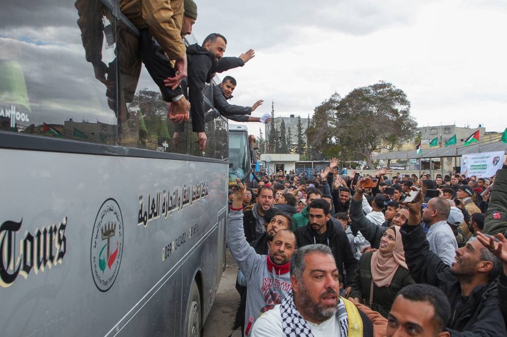 People react as Palestinian prisoners are greeted after being released from an Israeli jail, in Khan Younis in the southern Gaza Strip, on Saturday. REUTERS
