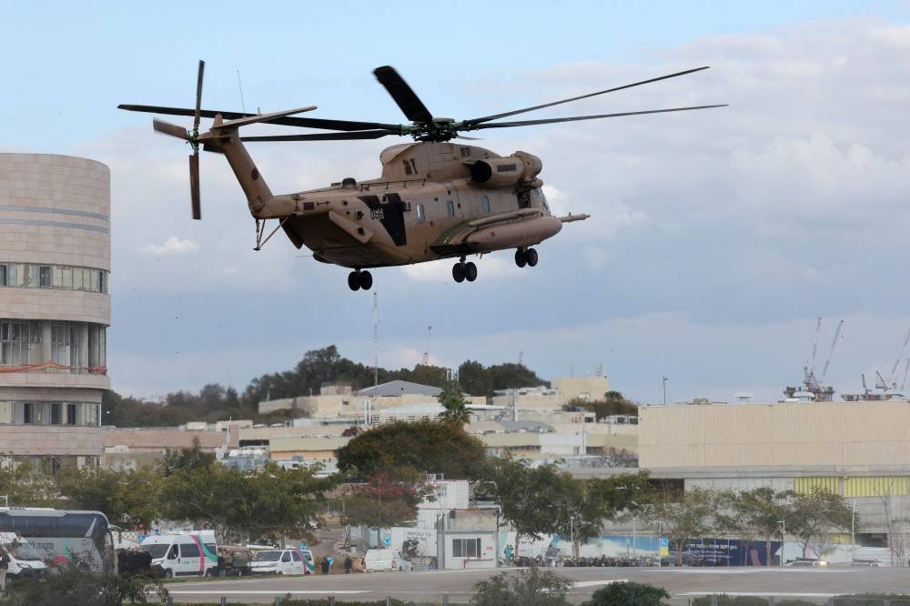 An Israeli military helicopter transporting newly-released Israeli hostages prepares to land on the heliport of the Sheba hospital in Ramat Gan near Tel Aviv, on Saturday. AFP