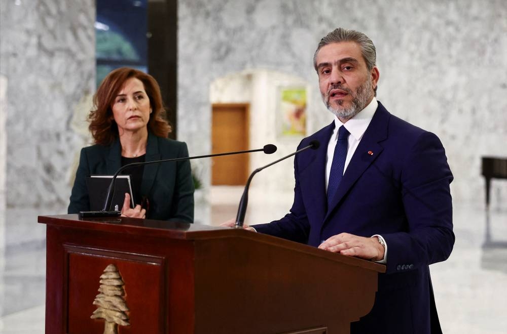 The Secretary-General of the Lebanese Cabinet, Mahmoud Makkieh speaks as he announces the names of the ministers following the formation of the new governement at the Presidential Palace in Baabda, Lebanon, on Saturday REUTERS