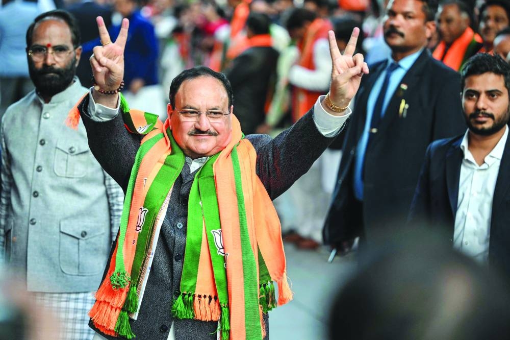 
Bharatiya Janata Party President J P Nadda flashes victory sign as he arrives at the party’s headquarters to celebrate the their win in the Delhi legislative assembly election in New Delhi yesterday. 