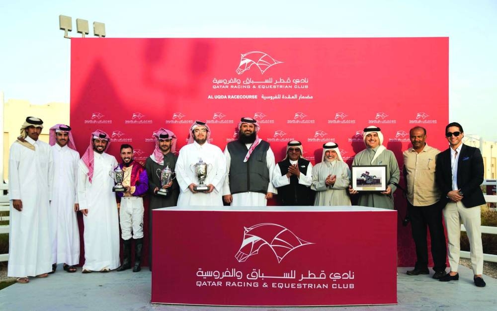 Connections of Eifrit  celebrate after the bay gelding won the Ain Sinan Cup at the Al Uqda Racecourse on Saturday. PICTURE: Juhaim