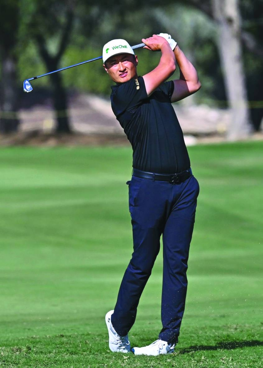 China’s Haotong Li plays a shot during the third round of the Commercial Bank Qatar Masters at the Doha Golf Club on Saturday. PICTURE: Noushad Thekkayil