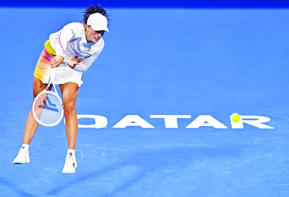 
Iga Swiatek of Poland in action against Maria Sakkari of Greece during their Qatar TotalEnergies Open match at the Khalifa Tennis Complex in Doha yesterday. Swiatek won 6-3, 6-2. PICTURES: Noushad Thekkayil 