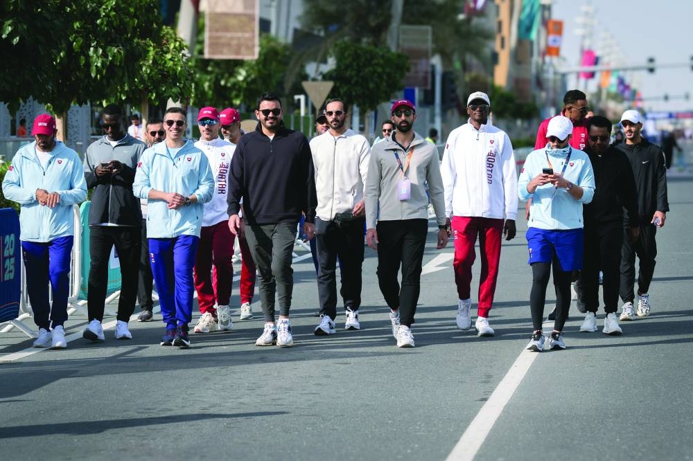 
QOC President HE Sheikh Joaan bin Hamad al-Thani with Secretary-General Jassim bin Rashid al-Buainain and other QOC officials and athletes at the Team Qatar Village events. 