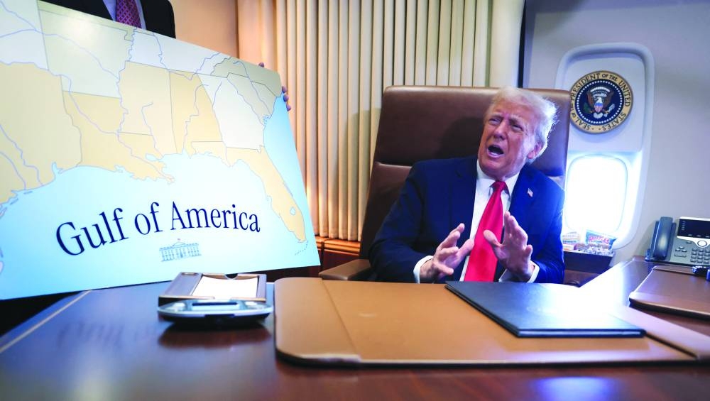 This picture (right) taken on Sunday shows Trump speaking to reporters after signing a proclamation renaming the Gulf of Mexico to the Gulf of America, while flying over the gulf aboard Air Force One en route to New Orleans to attend the Super Bowl. – Reuters