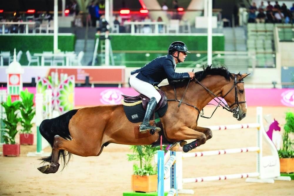 Spain’s Mariano Martinez Bastida astride Origi Van’T Geyzeven clears a hurdle at Al Shaqab’s Longines Outdoor Arena on Thursday.