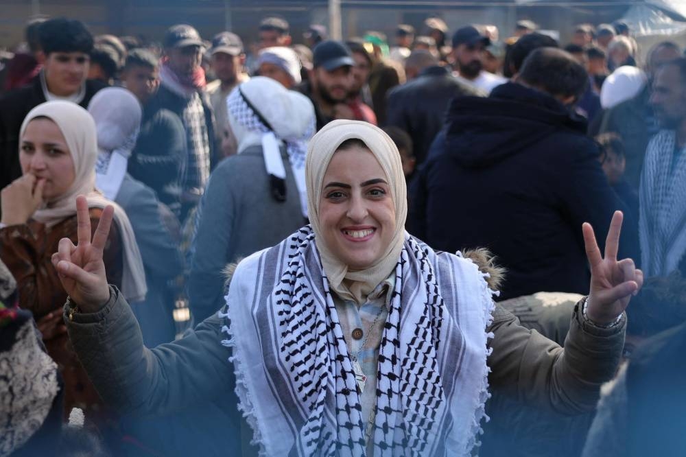 A relative of a freed Palestinian prisoner, released as part of the sixth hostage-prisoner exchange, awaits their arrival at the European Hospital in Khan Yunis in the southern Gaza Strip on Saturday. AFP