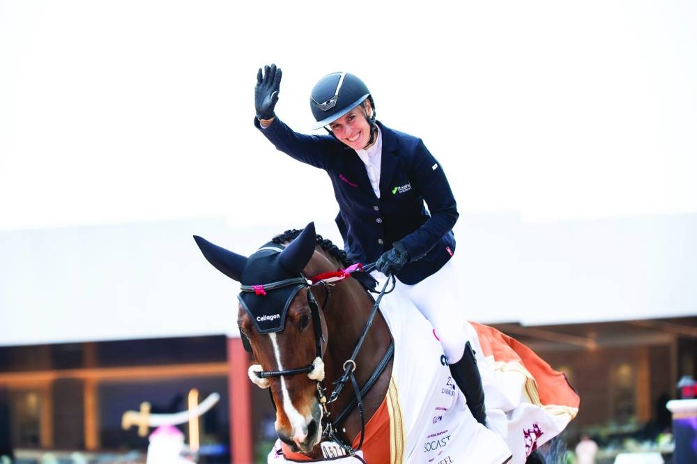 Germany’s Janne Meyer-Zimmermann astride bay gelding Messi Van ‘T Ruytershof celebrates after winning the CSI5* Grand Prix Jump-Off 1.60m class for HH The Amir’s Sword at the Longines Arena of Al Shaqab on Saturday.