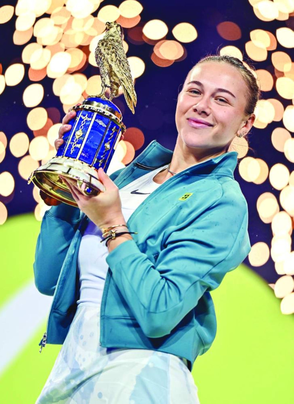 Amanda Anisimova of the US celebrates with the trophy after winning the Qatar TotalEnergies Open. PICTURE: Noushad Thekkayil