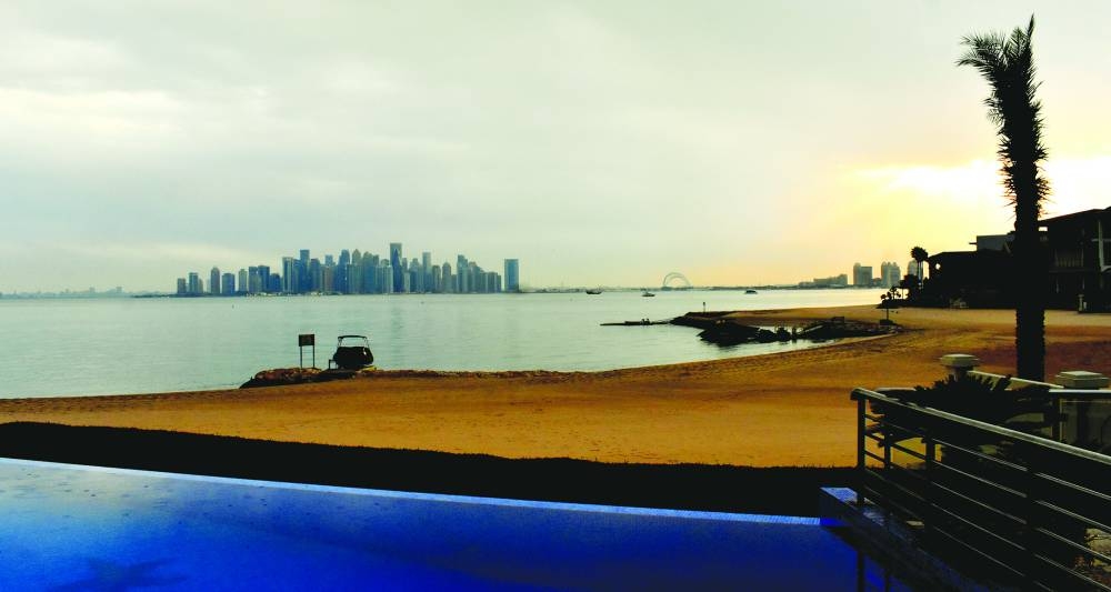 Rain clouds are seen over Doha's West Bay skyline, shortly before sunset Sunday. PICTURE: Thajudheen