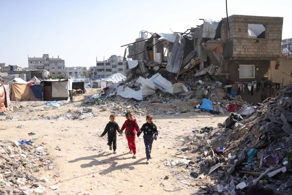 Palestinian children play amidst the rubble in Jabalia in the northern Gaza Strip, on Monday. AFP