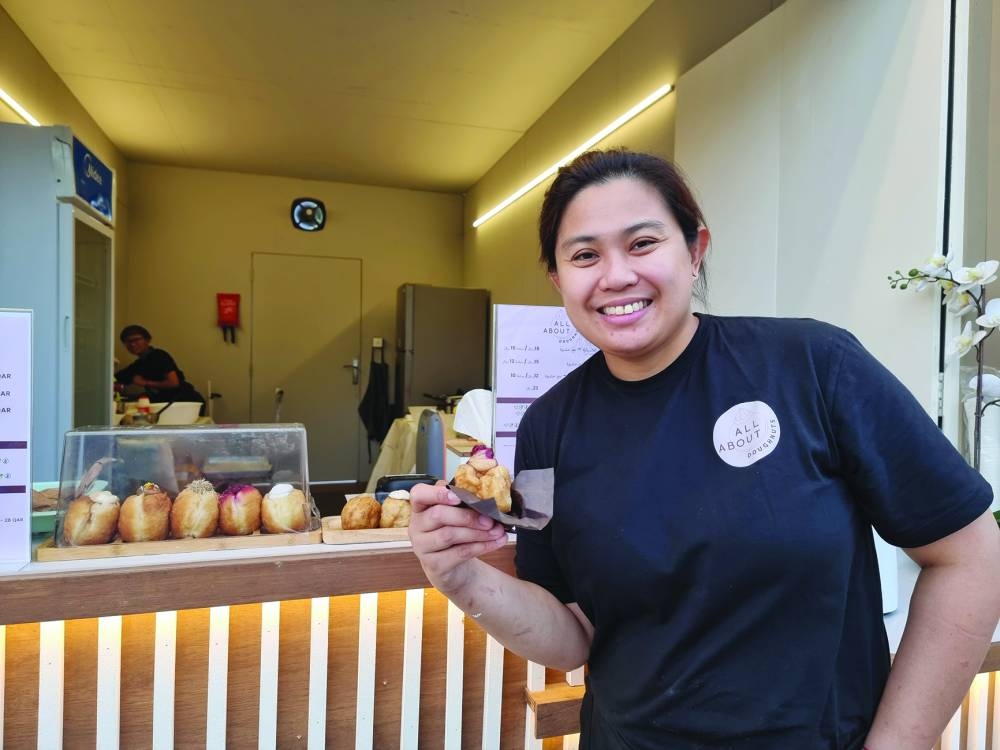 Michelle Alcazar showcases some of their doughnuts at QIFF 2025. PICTURES: Joey Aguilar  