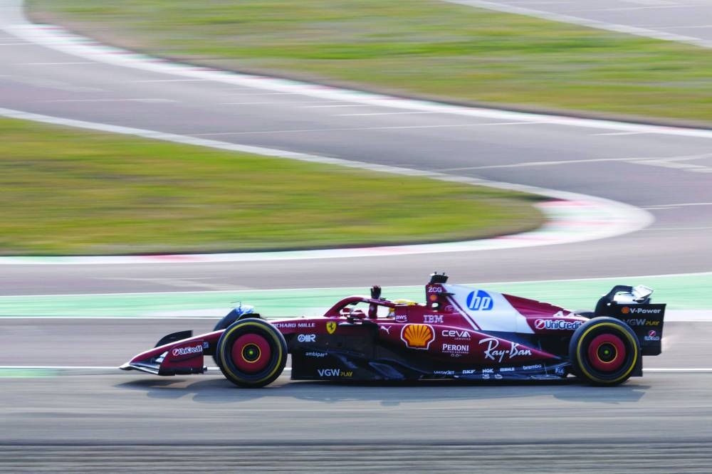 
British driver Lewis Hamilton steers the new F1 Ferrari SF-25 during testing at Fiorano Circuit, near Maranello, Italy. (AFP) 
