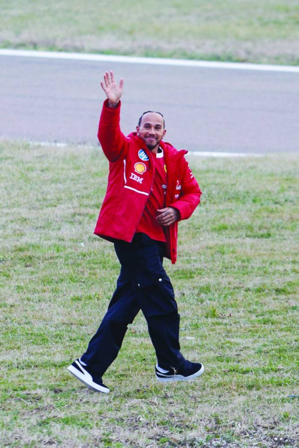 
Lewis Hamilton waves to fans after the testing in Fiorano, Northern Italy. 