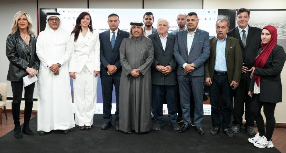 Abdullah bin Hayi al-Sulaiti, center with participants