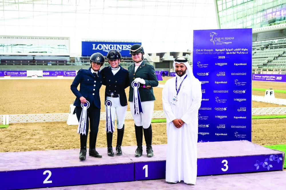 
Omar al-Bouainain, Deputy Event Director, poses with Para Dressage podium winners. 