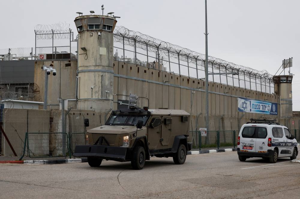 Vehicles move outside the Israeli military prison, Ofer, on the day Israel is expected to release Palestinian prisoners, near Ramallah, in the Israeli-occupied West Bank, on Saturday. REUTERS