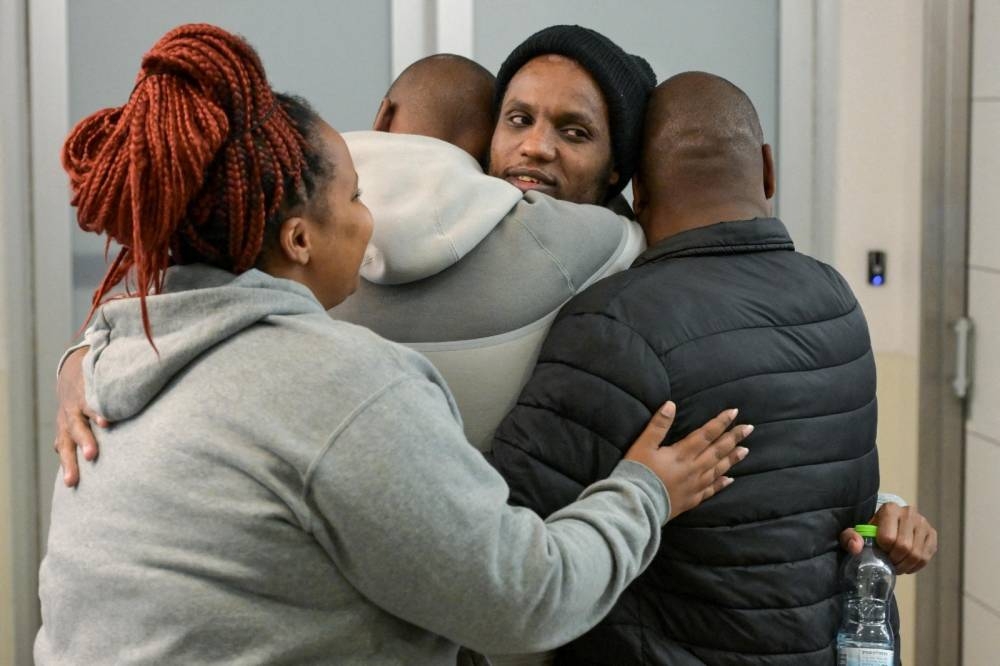 Avera Mengistu, who entered Gaza around a decade ago and was held there since, reacts during the reunion with his family, after he was released, at Ichilov Hospital, in Tel Aviv, Israel, on Saturday. REUTERS