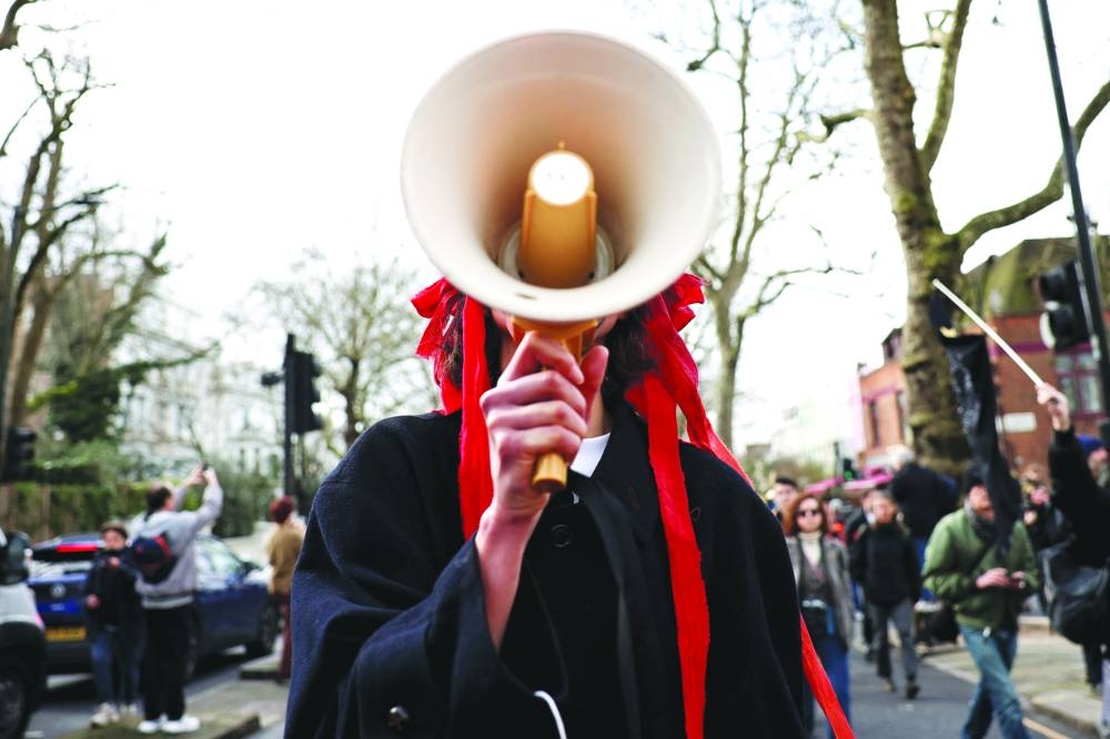 
A protester holds a megaphone during a demonstration calling for solidarity with Ukraine, outside the Russian embassy in London. 