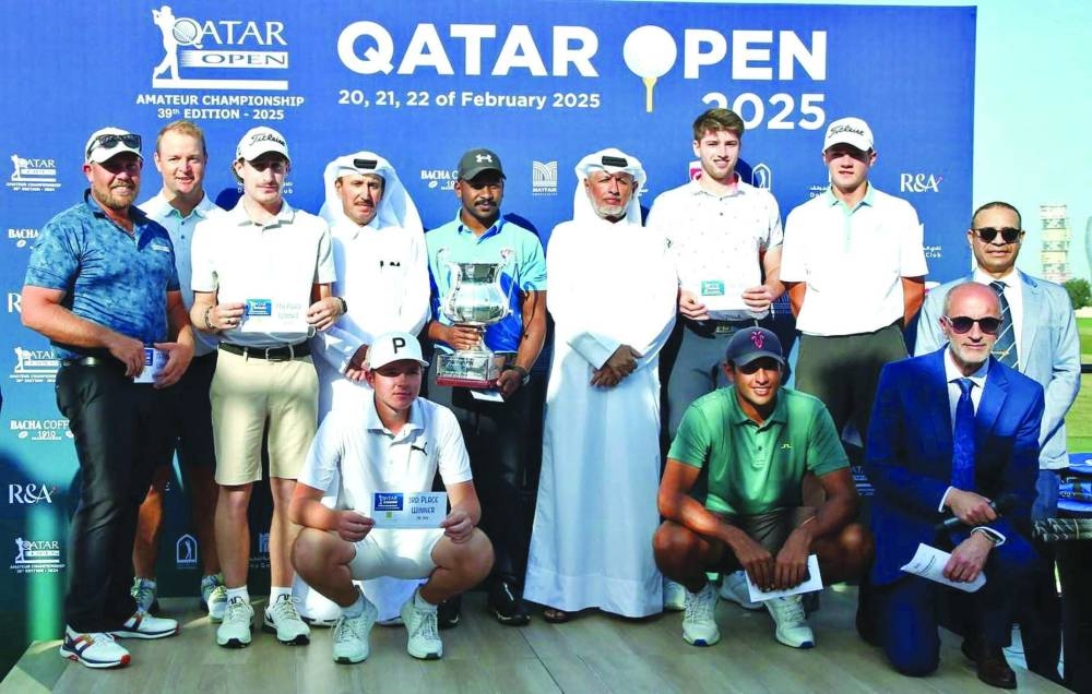 Saleh al-Kaabi poses with Qatar Golf Association officials after winning the Qatar Open Amateur Golf Championship at the Doha Golf Club on Saturday.