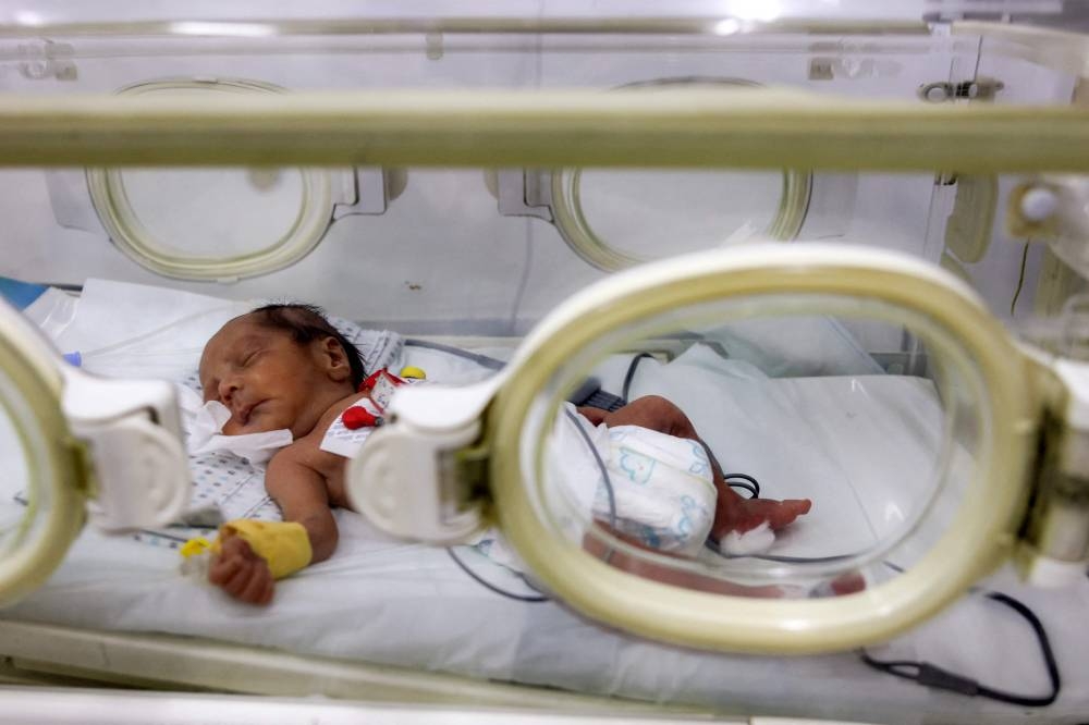 A prematurely-born infant lies in an incubator at the neonatal intensive care unit (NICU) at the Patient Friend's Benevolent Society hospital in Gaza City on Tuesday. AFP